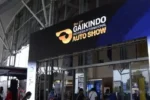 Pintu masuk GIIAS 2025 dengan logo resmi pameran otomotif dan tulisan tiket giias berapa
